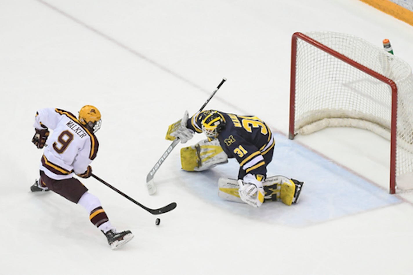 Gophers freshman forward Sammy Walker moved in on Michigan goalie Strauss Mann during the Big Ten quarterfinals in March. Walker had 10 goals and 16 assists in his rookie season.