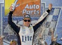Brad Keselowski celebrates after winning the NASCAR Sprint Cup auto race at Richmond International Raceway in Richmond, Va., Saturday, Sept. 6, 2014. 