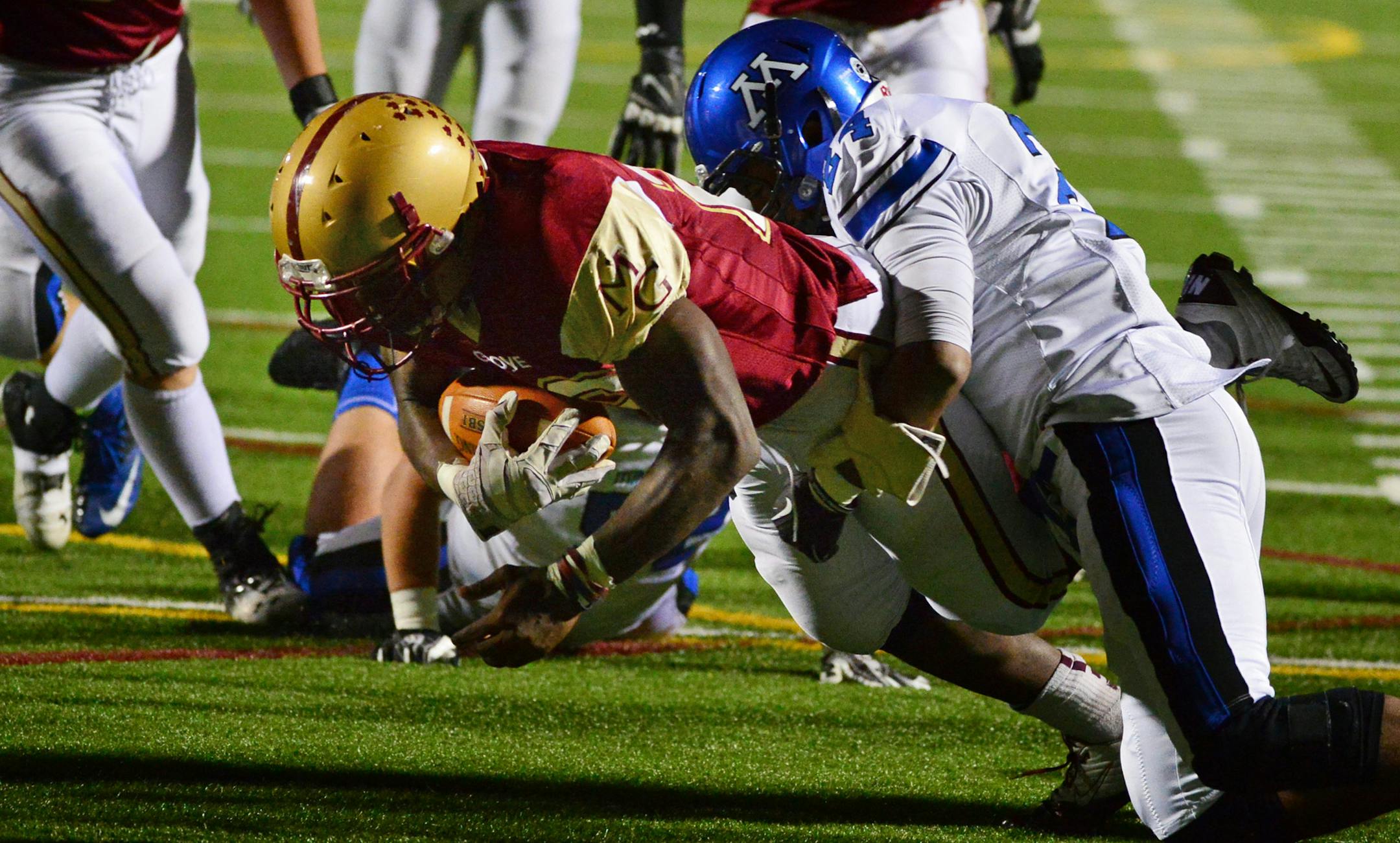Maple Grove 28 Tahi Nomane tried unsuccessfully to get the ball over the end zone in the second quarter but was held back by Minnetonka 34 Stone Swanson. Minnetonka played at Maple Grove in Class 6A football. The winner of Friday's game goes on to the State Tournament. Friday, November 1, 2013. ] GLEN STUBBE * gstubbe@startribune.com