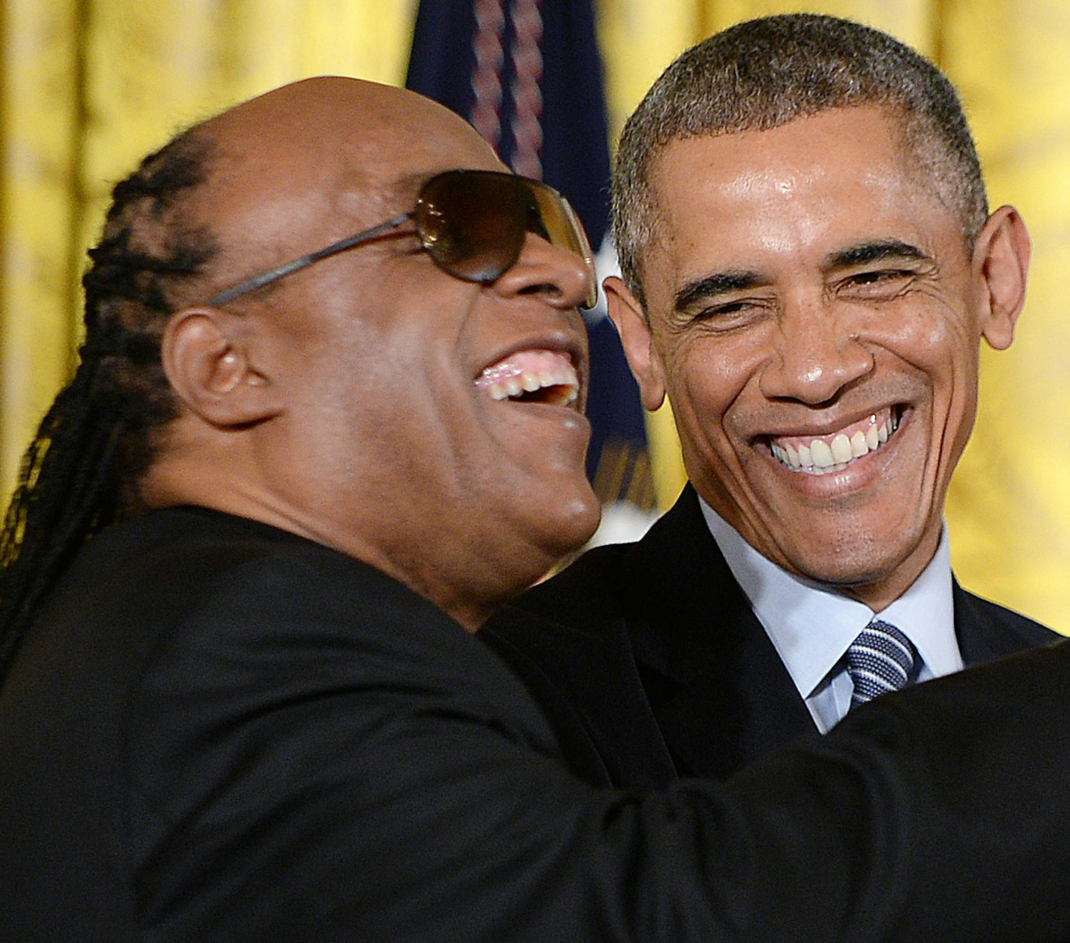 U.S. President Barack Obama presents the Medal of Freedom to musician Stevie Wonder during a ceremony in the East Room of the White House on Monday, Nov. 24, 2014, in Washington, D.C. The Medal of Freedom is the country's highest civilian honor. (Olivier Douliery/Abaca Press/TNS) ORG XMIT: 1160540