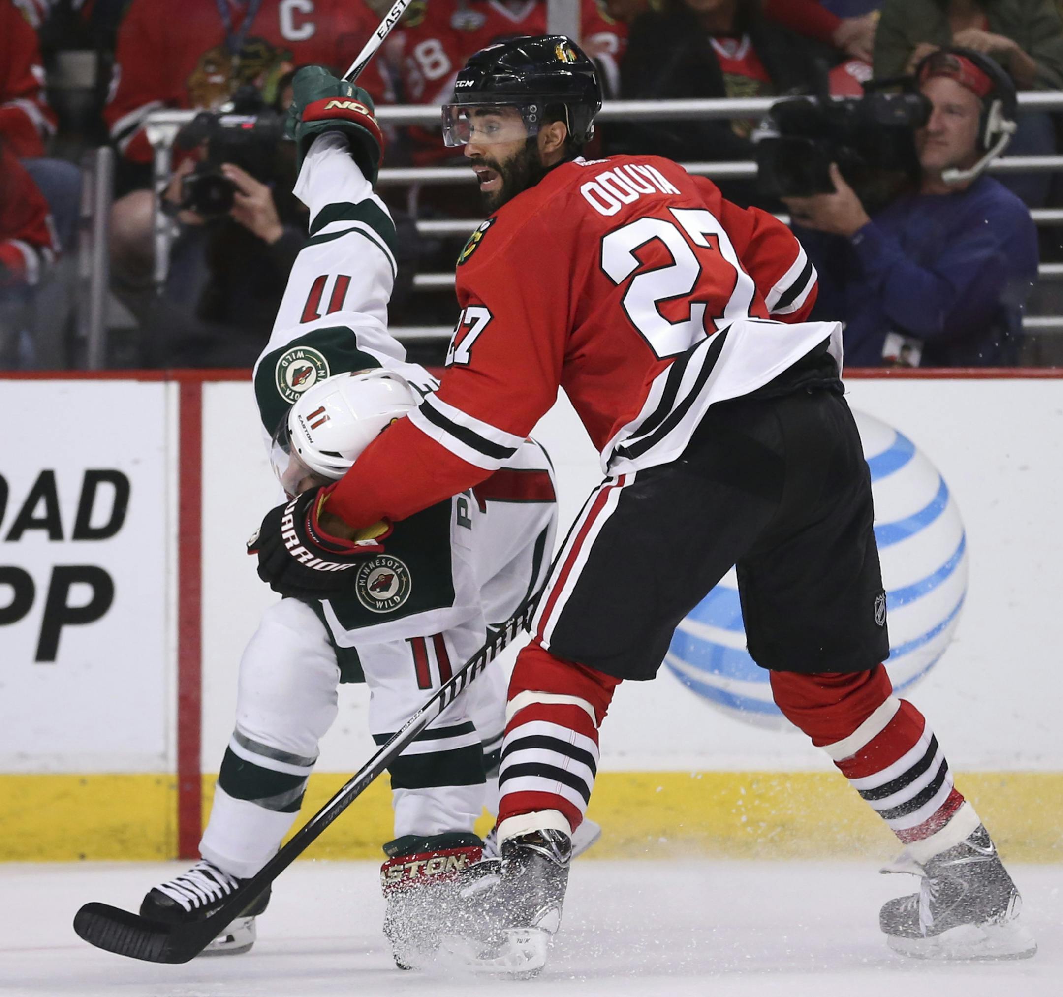 Wild left wing Zach Parise (11) lost his balance while staying ahead of Blackhawks defenseman Johnny Oduya (27) in the third period Sunday night. ] JEFF WHEELER &#xef; jeff.wheeler@startribune.com The Minnesota Wild 4-1 to the Chicago Blackhawks in the second game of their NHL playoff series Sunday night, May 3, 2015 at United Center in Chicago.