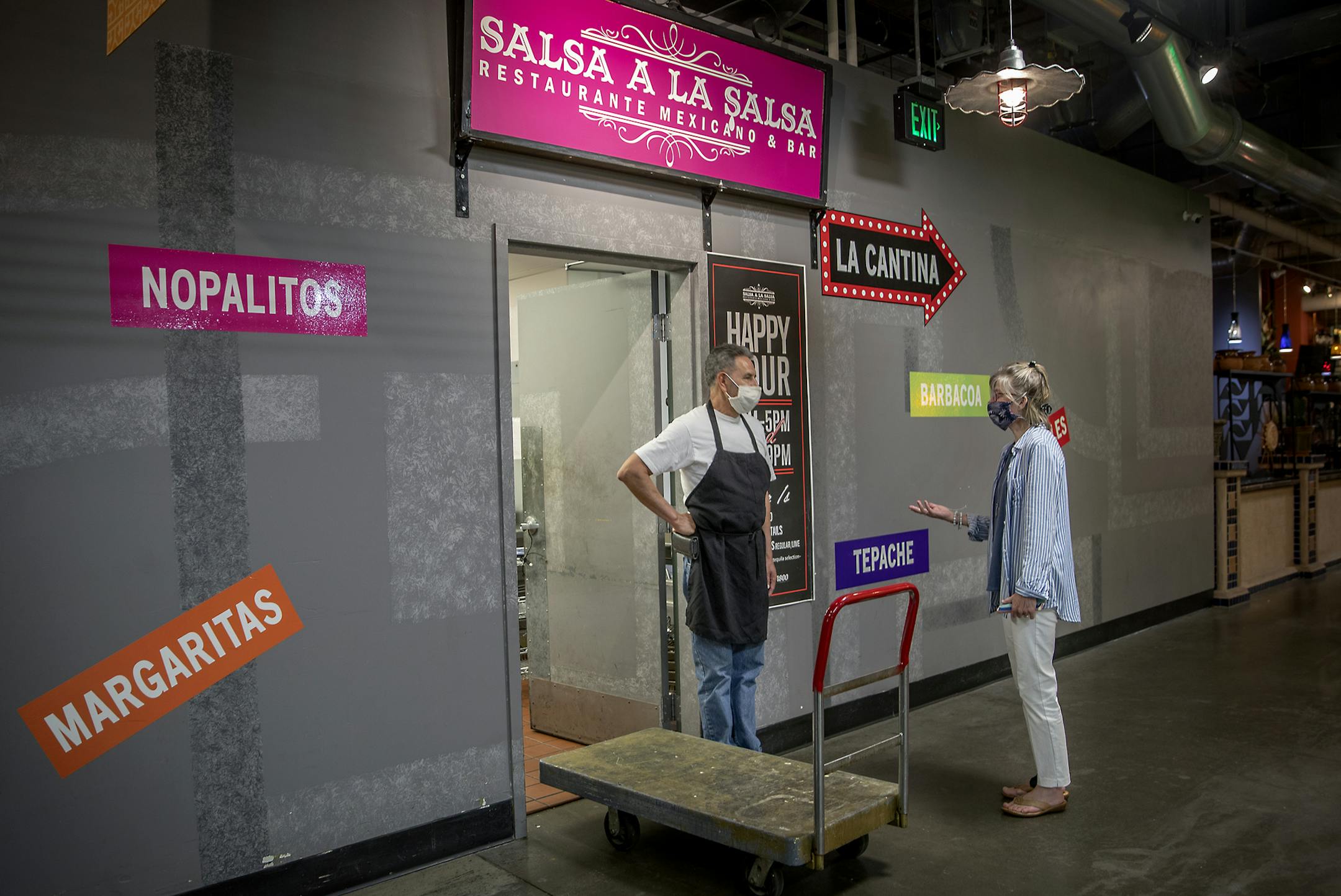 Fredrikson & Bryon Director of Pro Bono & Community Services, Pamela J. Wandzel, right, talked to one of their clients in the Midtown Global Market building, Tuesday, June 16, 2020 in Minneapolis, MN. Fredrikson & Bryon set up a free legal clinic in the office of the Graves Foundation to help businesses burned by rioting on Lake Street, and University Ave. and on the North side. ] ELIZABETH FLORES • liz.flores@startribune.com