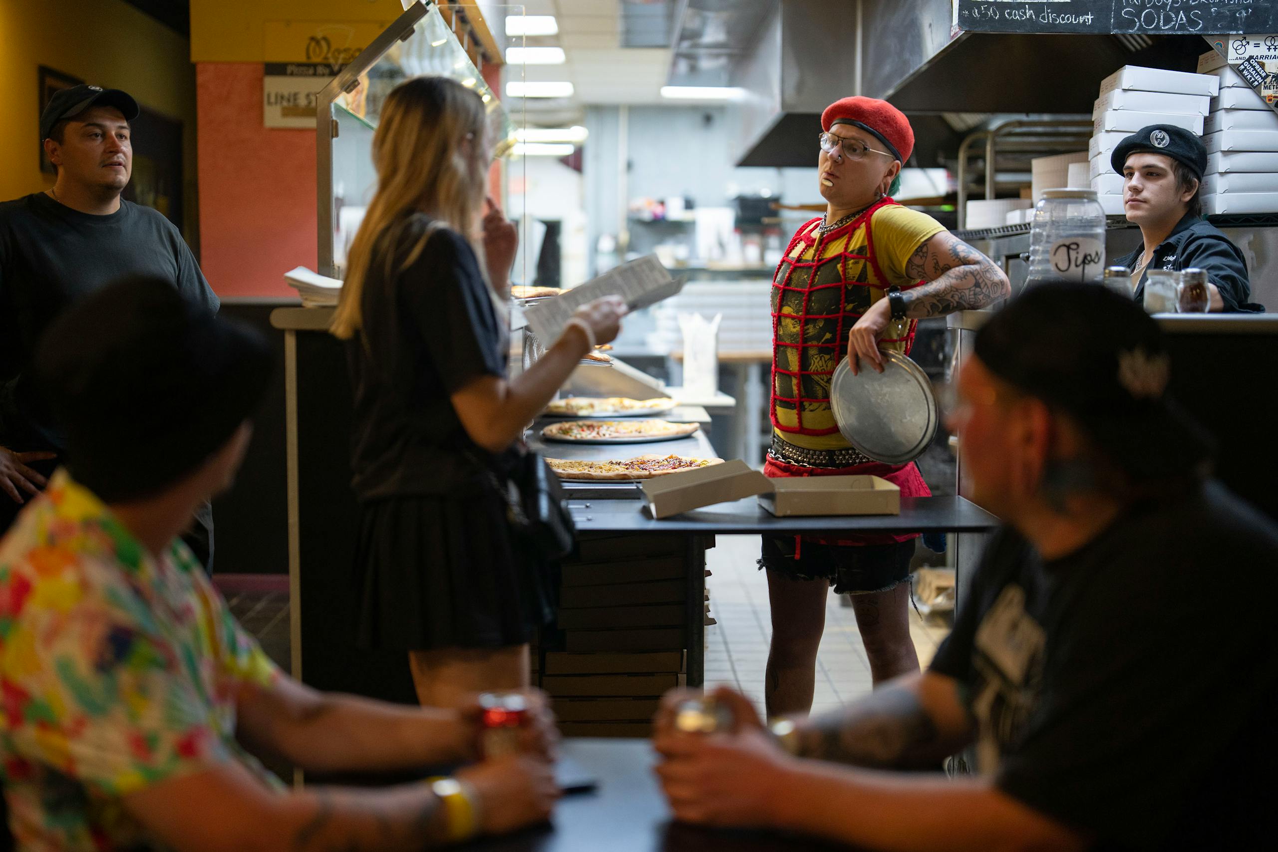 After weathering the pandemic and the riots, construction has hit Uptown hard, said Mat Pfeifer, center, an employee at Mesa Pizza.