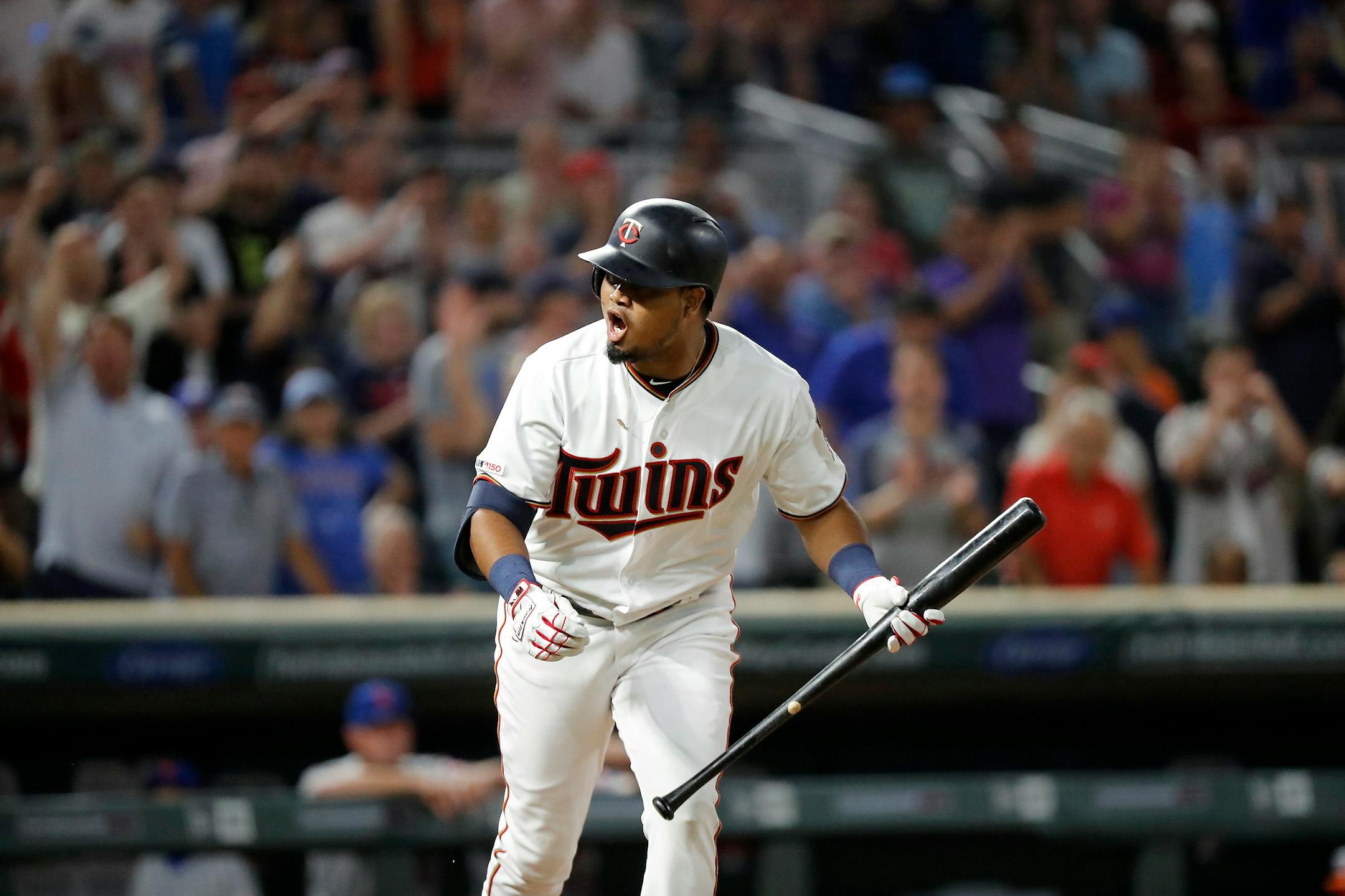 Twins second baseman Luis Arraez celebrates a walk in the ninth inning.