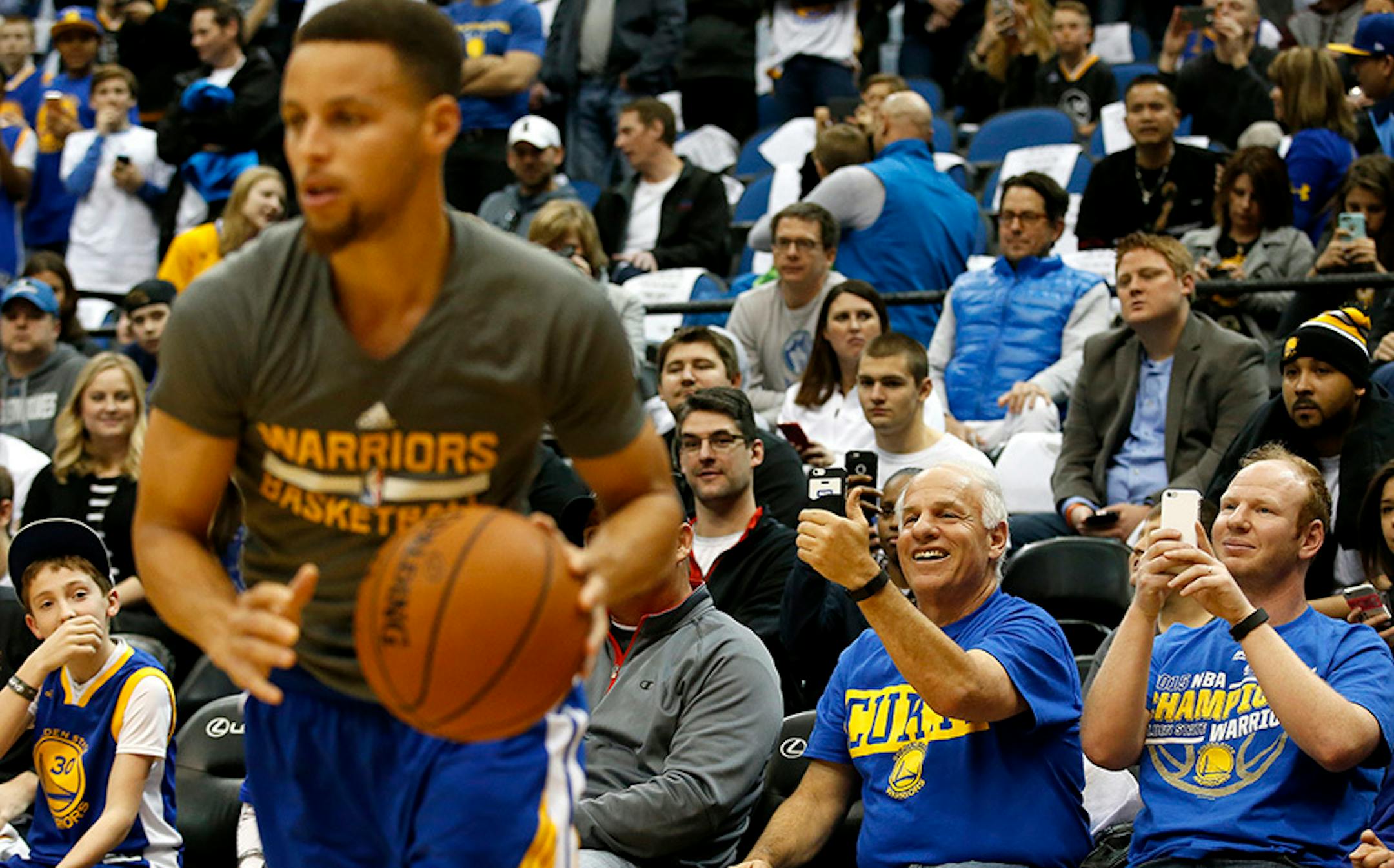 Golden State Warriors Steph Curry during his pregame warm up before Monday night's game at Target Center.