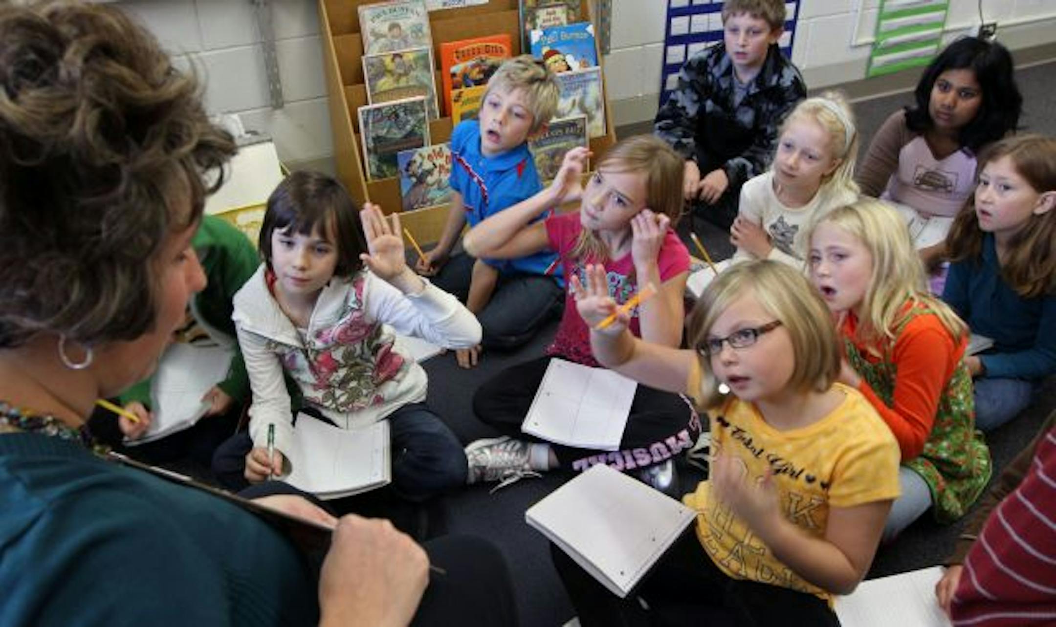 Sage Academy/WestWood Elementary 3rd grade teacher Brandie Ahlstrand worked with her students during class.