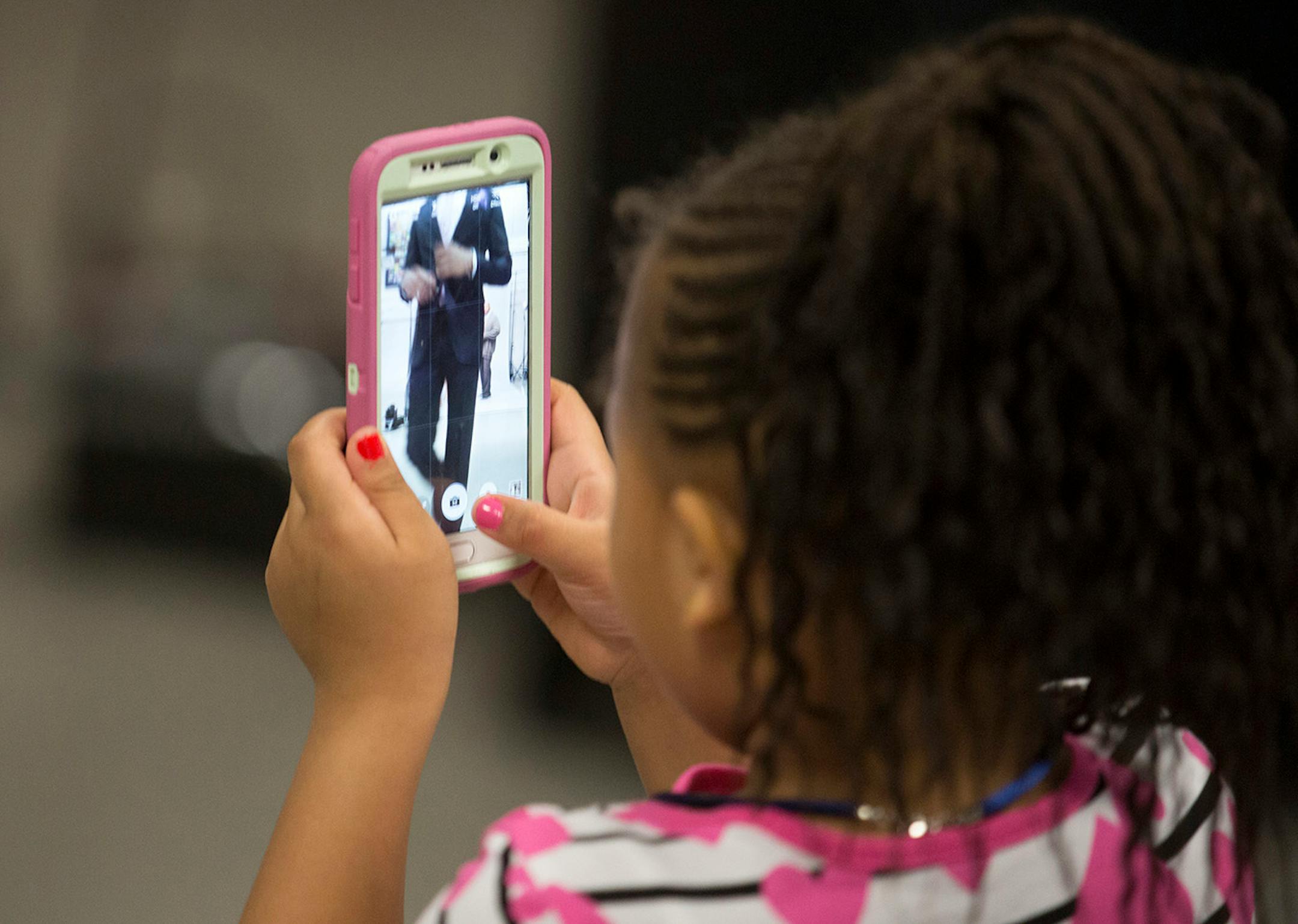 Jolani Ammons, 4, has a hard time getting all of her uncle Karl-Anthony Towns in a photo during the NBA Rookie of the Year Award announcement on May 16, 2016 in Minneapolis.