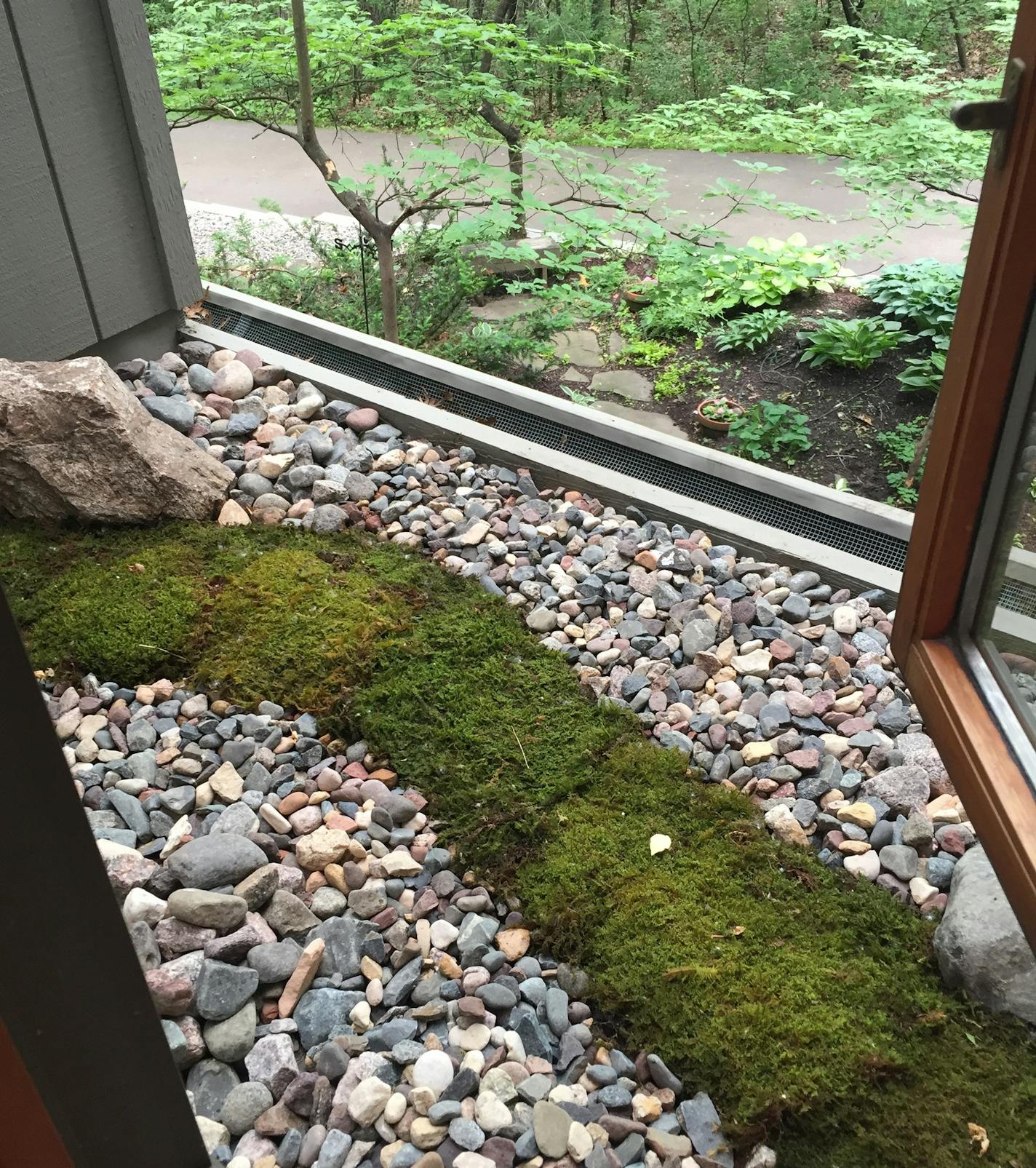 The rooftop rock garden includes a moss stream.