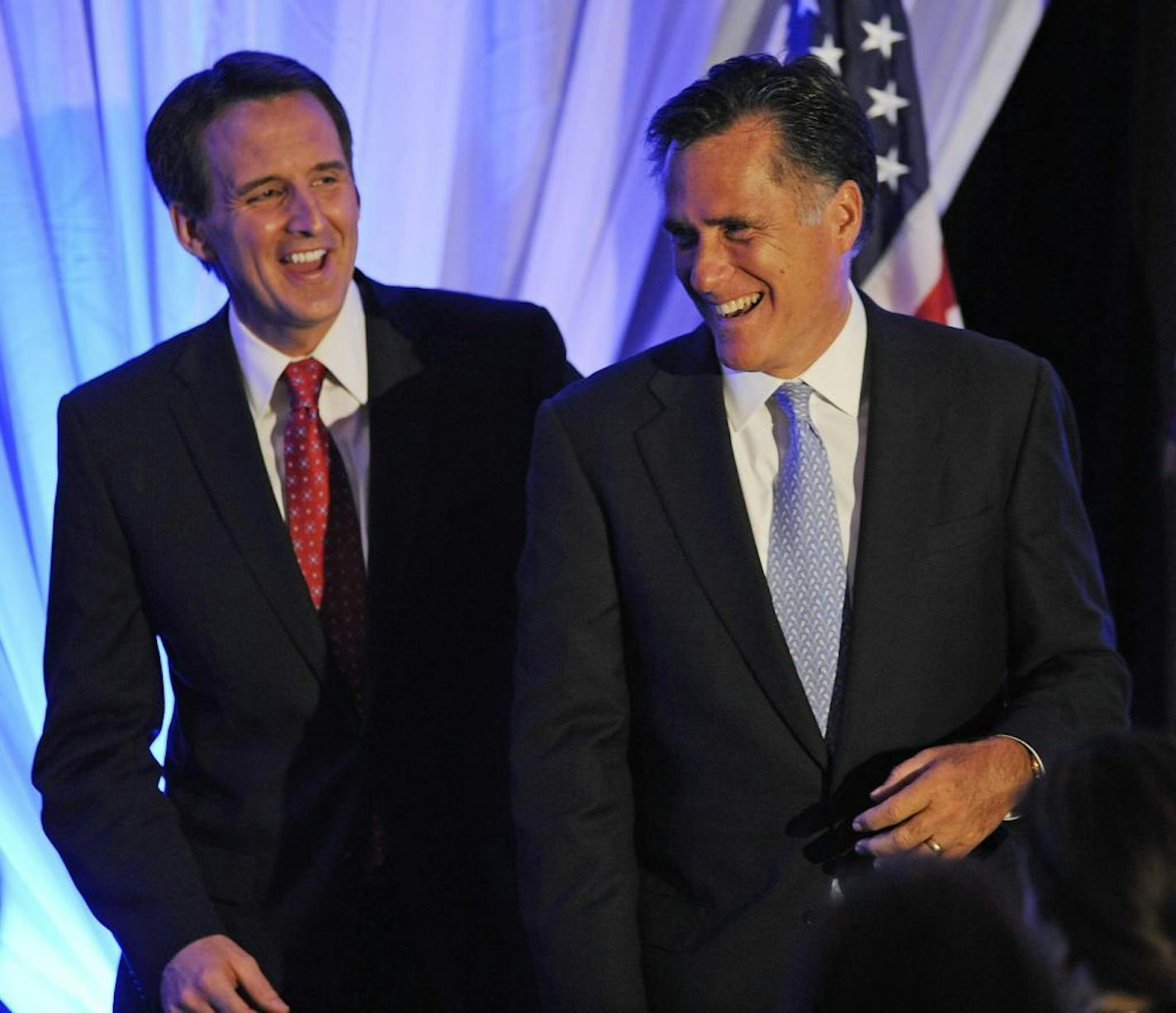 FILE - In this April 9, 2010, file photo Minnesota Gov. Tim Pawlenty , left, gives former Massachusetts. Gov. Mitt Romney a pat on the back at a conservative Freedom Foundation of Minnesota event in Bloomington, Minn. Less than a year before the lead-off primaries and caucuses, many of the Republican Party's biggest fundraisers aren't aligned with any one. All-but-certain candidates Romney and Pawlenty have lined up pieces of their fundraising teams; others are moving more slowly. And none is ea