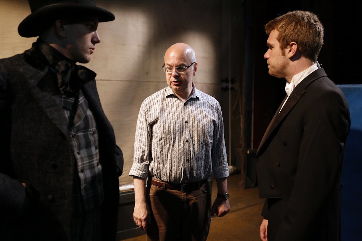 Director John Miller-Stephany, center, with actors Corey Quinn Farrell, left, and Bradley Hildebrandt during rehearsal for the 2016 play "Under the Gaslight" on the Minnesota Centennial Showboat.