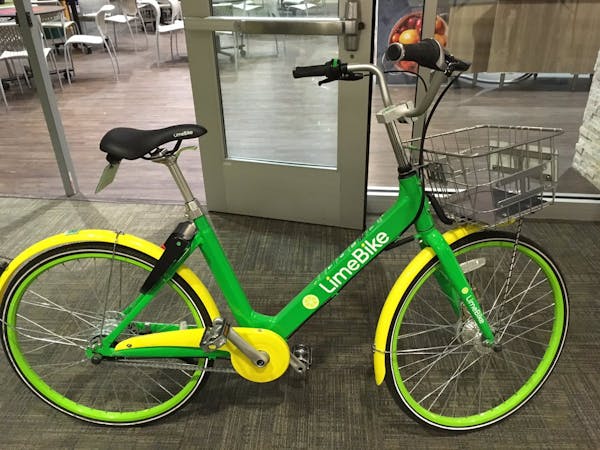 A LimeBike dockless bike. A solar panel in the basket powers the lock. Lime Bike is vying for TC bike-share market.