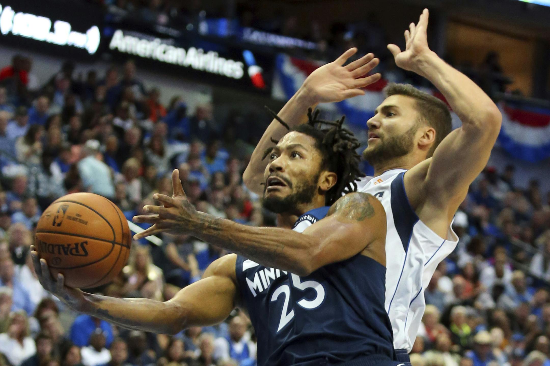 Minnesota Timberwolves guard Derrick Rose (25) goes up for a shot against Dallas Mavericks forward Maximilian Kleber (42) in the first half of an NBA basketball game Saturday, Oct. 20, 2018, in Dallas. (AP Photo/Richard W. Rodriguez)