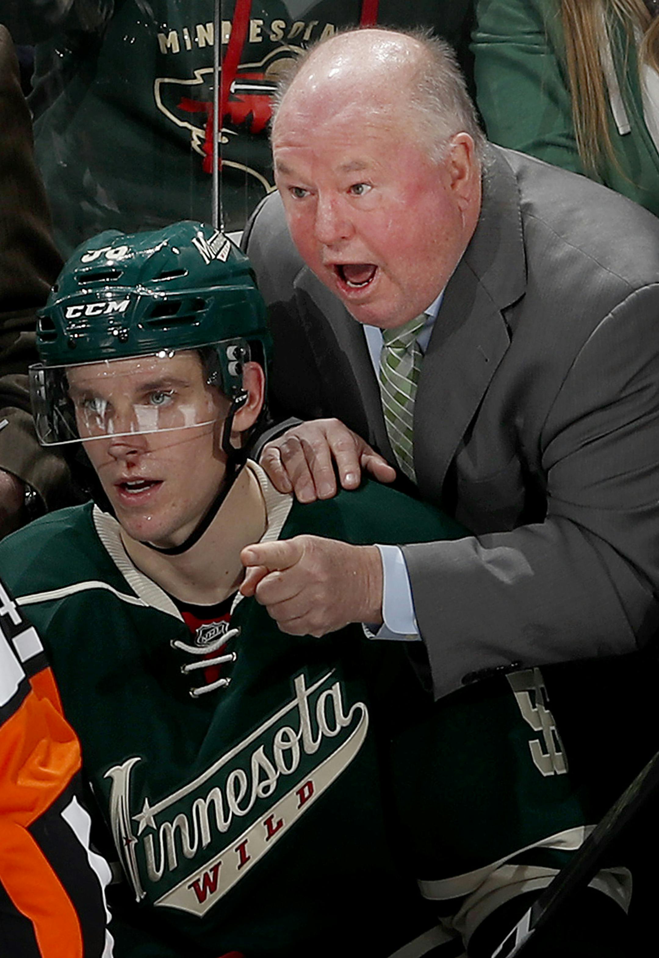 Wild head coach Bruce Boudreau discusses a non-goal call with referee Jake Brenk (42) in the third period Sunday, Dec. 11, 2016 during the Wild vs. Blues game at the Xcel Energy Center in St. Paul, Minn. The Wild won 3-1. (Carlos Gonzales/Minneapolis Star Tribune/TNS) ORG XMIT: 1194463