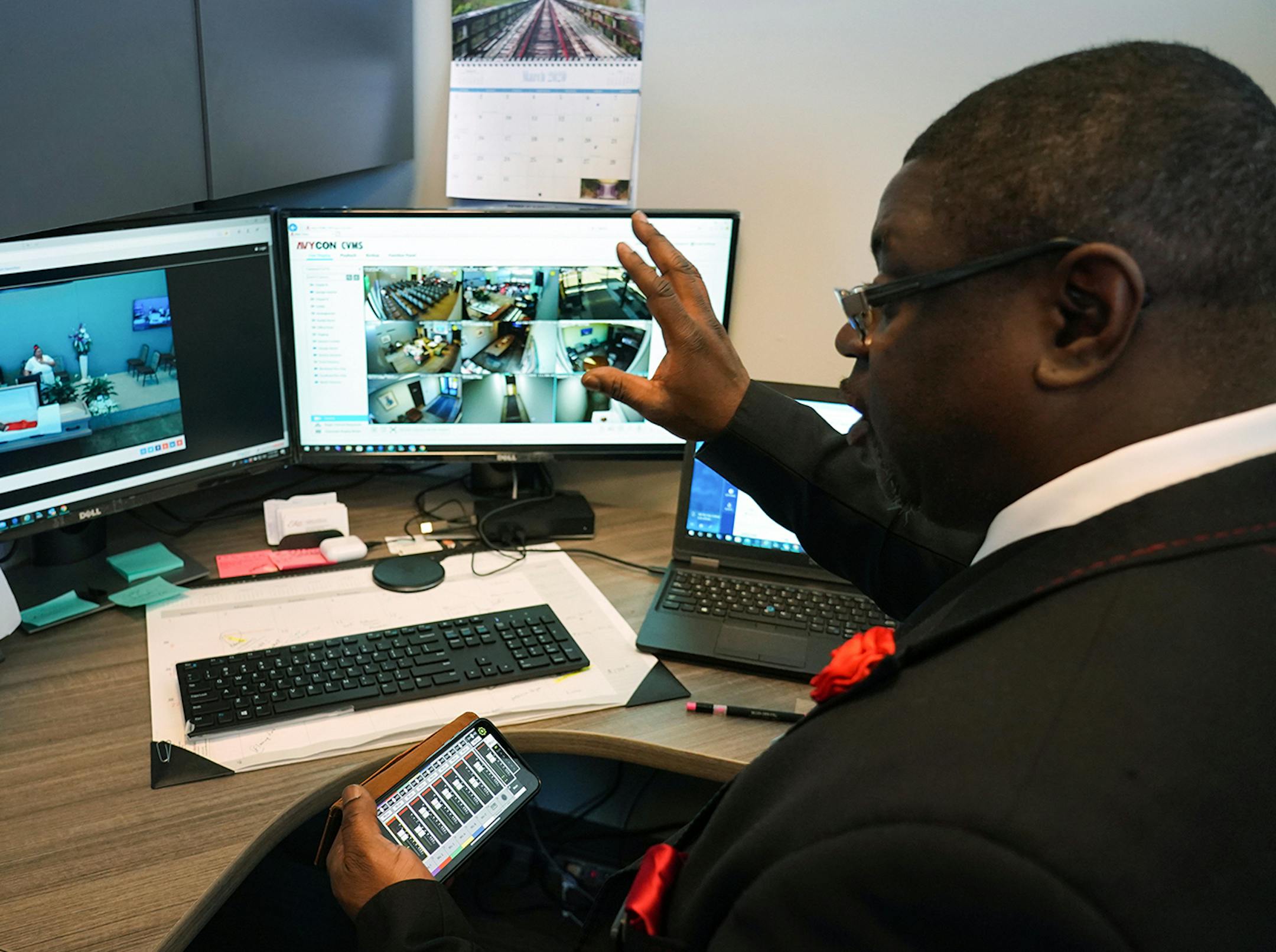 Estes Funeral Chapel directors assistant Curtis Mayfield can monitor services through the multiple video cameras installed throughout the building. Mayfield can also adjust the audio through an application on his phone.