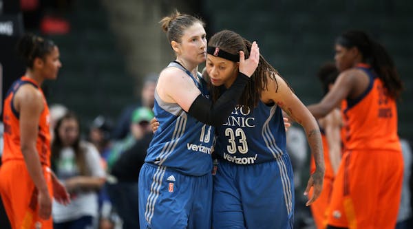 Minnesota Lynx guard Lindsay Whalen (13) left and Seimone Augustus (33) celebrated a 80- 78 win over Connecticut at Xcel Energy Center May 22, 2017 in
