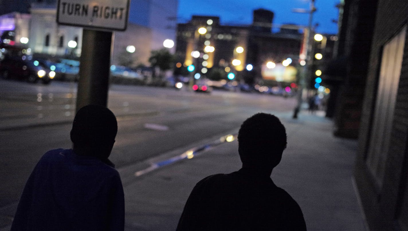 In downtown, a Minneapolis On July 1, 2014, a group of teenagers Antwon Seamon and JoJo Knight, left to right, claimed to be 13 or older were wandering the streets a little after nine o'clock. They would not be breaking curfew if their stated age is correct] rtsong-taatarii@startribune.com