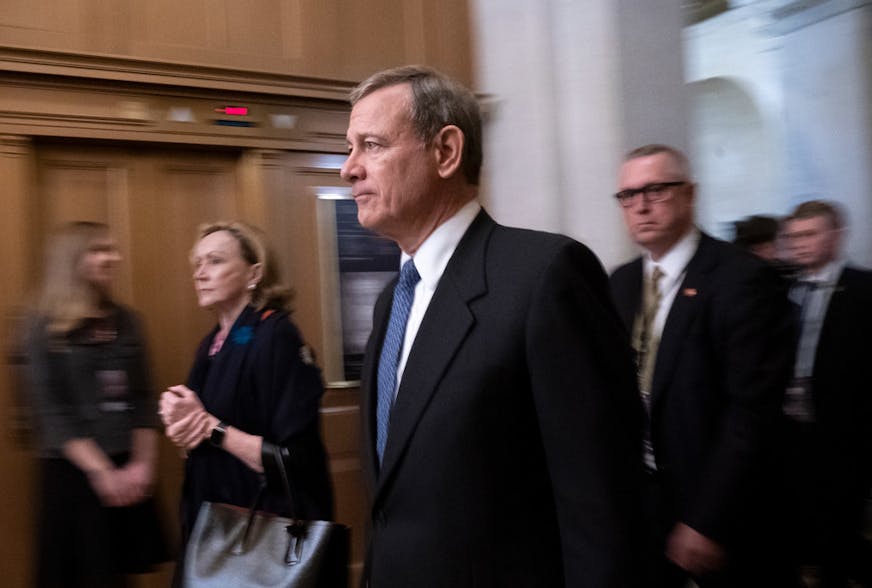 Chief Justice John Roberts left the Senate on Saturday after opening arguments by President Donald Trump's defense team. His team made only a two-hour presentation, reserving the heart of its case for Monday.