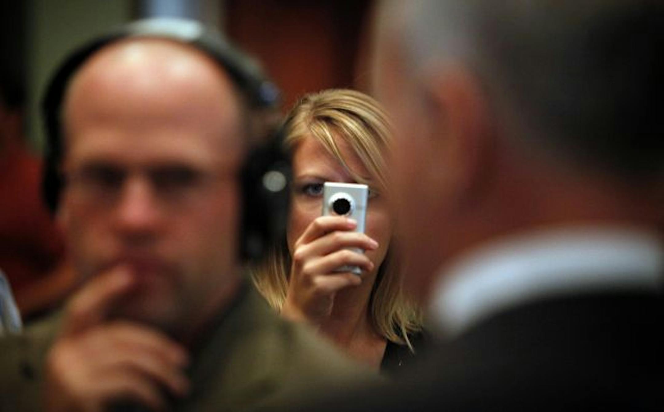 Republican tracker Abby Michaud used a Flip camera to record DFL candidate Mark Dayton after Tuesday's debate involving the DFLer, Republican Tom Emmer and Independence Party candidate Tom Horner. Dayton has accused GOP trackers of harassment at a weekend event.