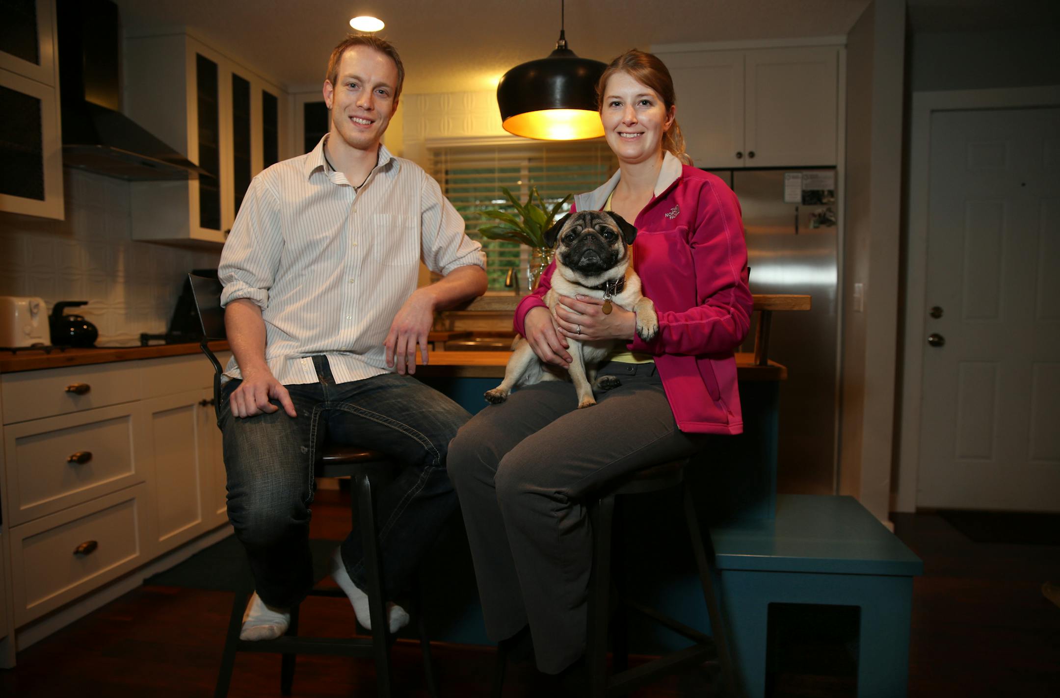 Peter Soderberg and Lauren Haverstock went out to dinner and came back to a new kitchen in the new HGTV show Renovation Raiders. This included a new kitchen with a built-in doghouse and a bar with refrigerated beer dispenser. The pug is named Toshiro.] richard tsong-taatarii@startribune.com