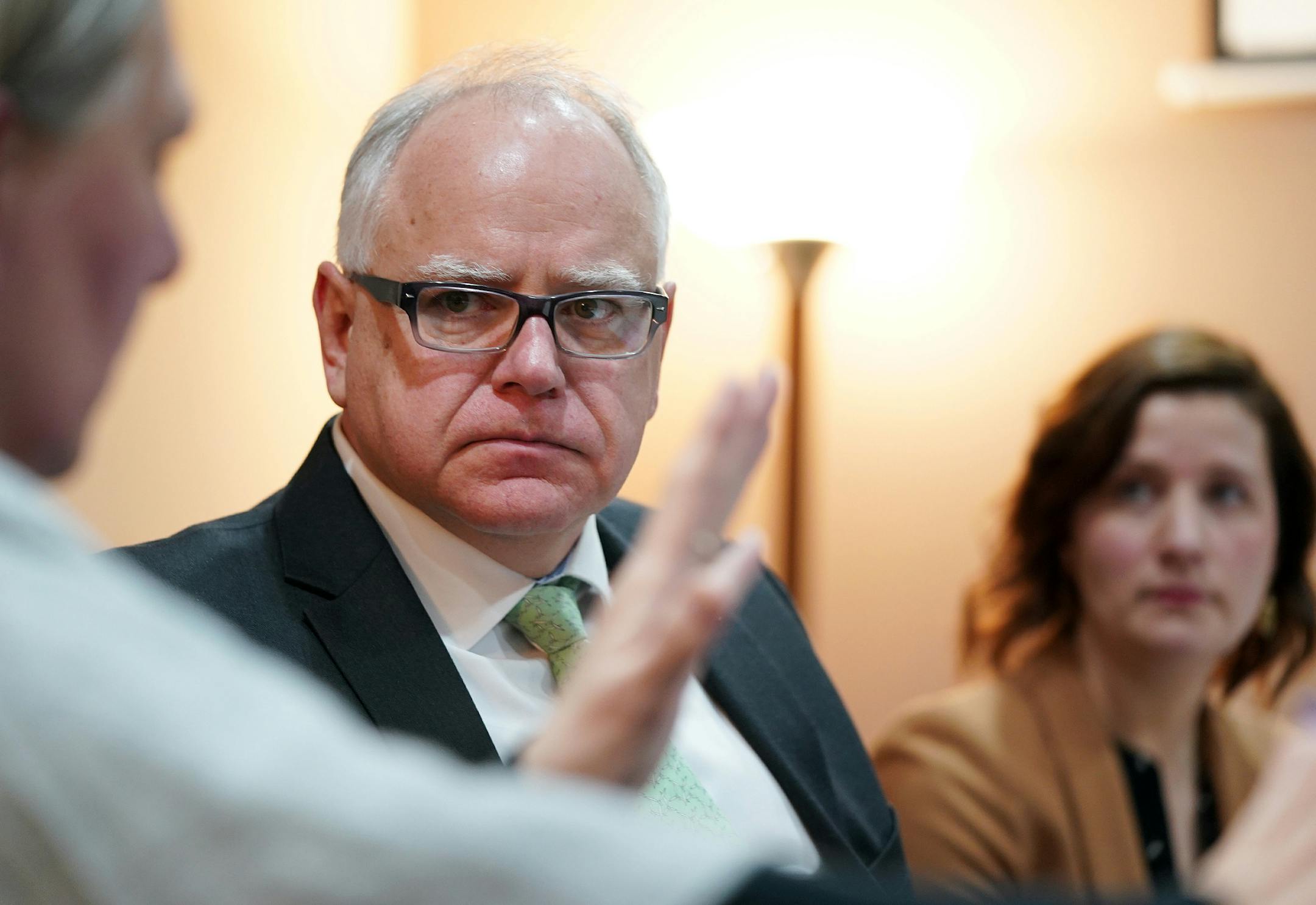 Gov. Tim Walz talked with Catholic Charities navigator Sue Killian during a round table discussion on health care at the Mid-Minnesota Legal Aid in St. Cloud Thursday. ] ANTHONY SOUFFLE • anthony.souffle@startribune.com Gov. Tim Walz held a press conference and round table to discuss the health care pieces of his budget Thursday, March 14, 2019 in St. Cloud, Minn.