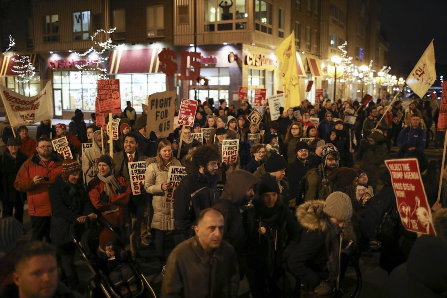 Demonstrators blocked the intersection of 15th Ave. SE and 4th St. SE in Dinkytown and listened to speakers.