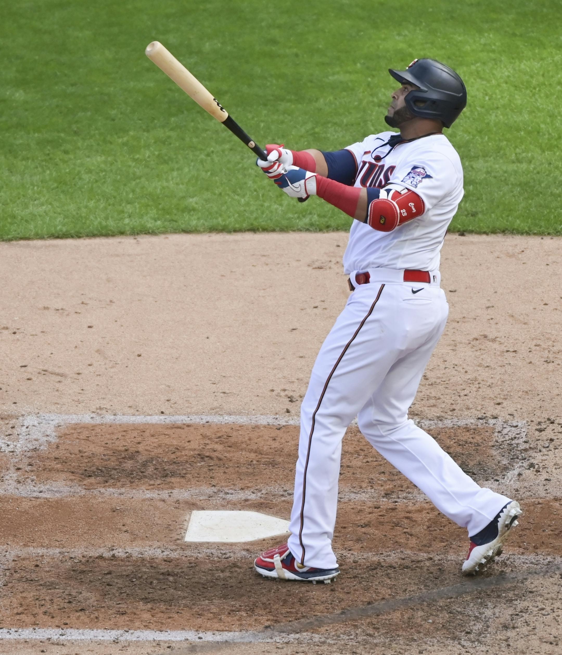 Minnesota Twins designated hitter Nelson Cruz (23) followed through with his swing after hitting a solo home run in the bottom of the fourth inning against the Kansas City Royals.