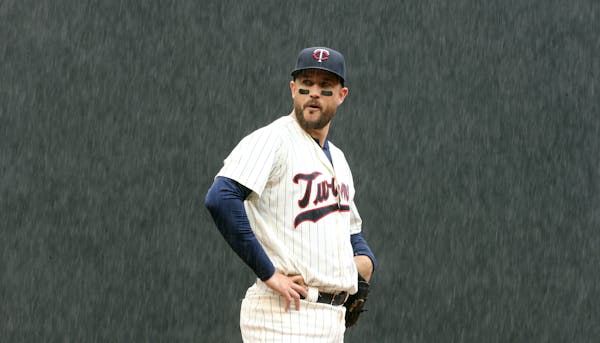 Trevor Plouffe during a rainstorm in the 2016 season, his last season with the Twins.