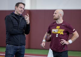 Vikings head coach Kevin O’Connell, left, talked with former Gophers quarterback Tanner Morgan at the Minnesota Pro Day for draft prospects in March