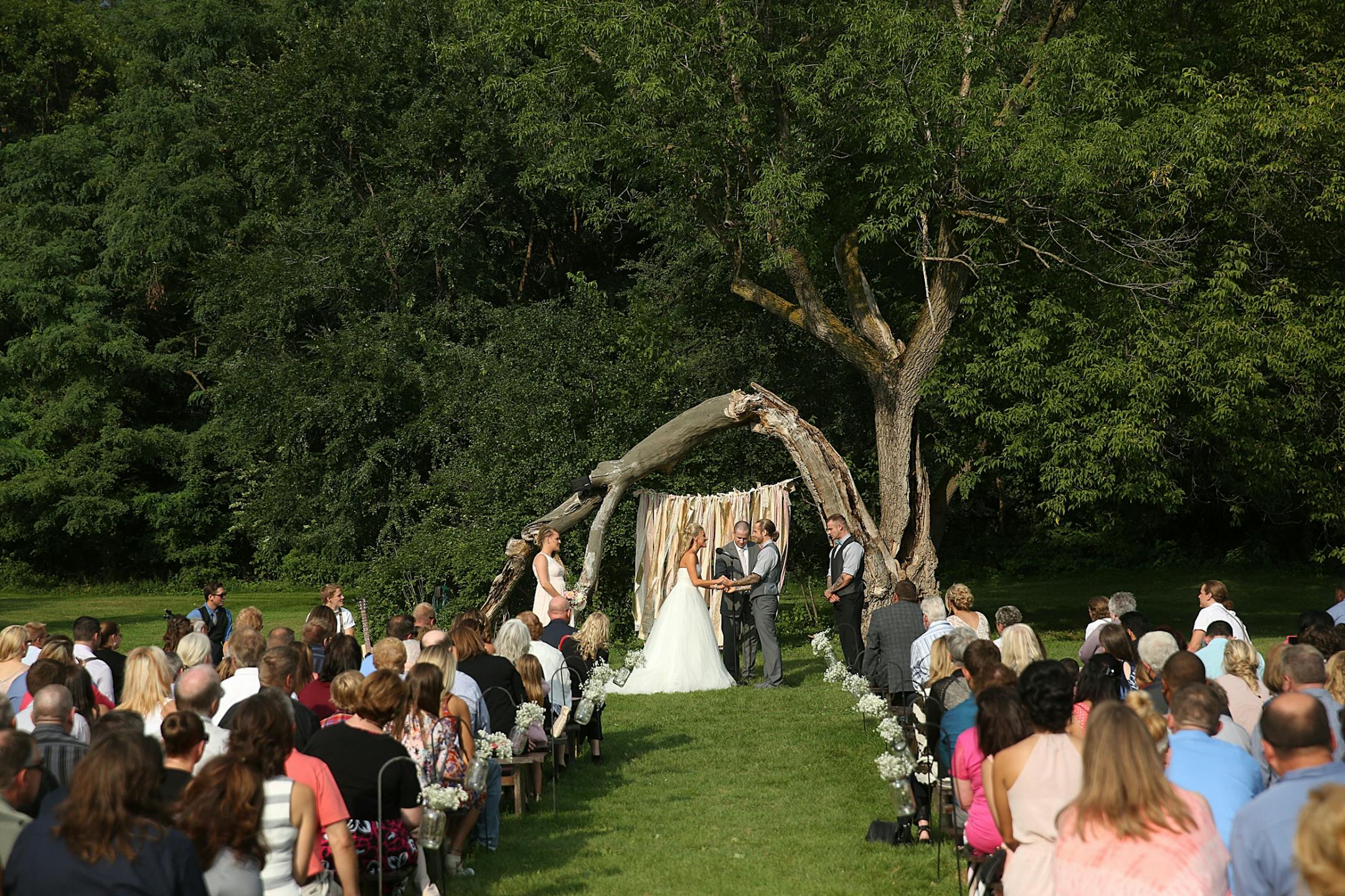 Bride Savannah Koehnen and groom Jeremy Eckert joined hands during the marriage ceremony.