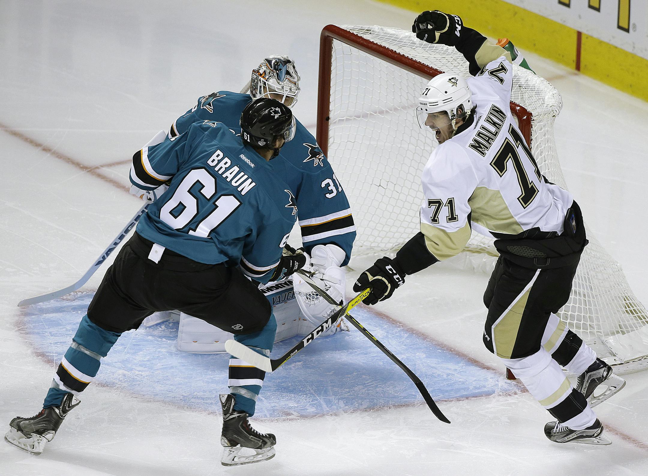 Pittsburgh’s Evgeni Malkin, right, celebrated after scoring his game-winning goal in the second period after getting the puck by Sharks goalie Martin Jones and Vadnais Heights native Justin Braun. The Penguins head back to Pittsburgh with a 3-1 series lead.