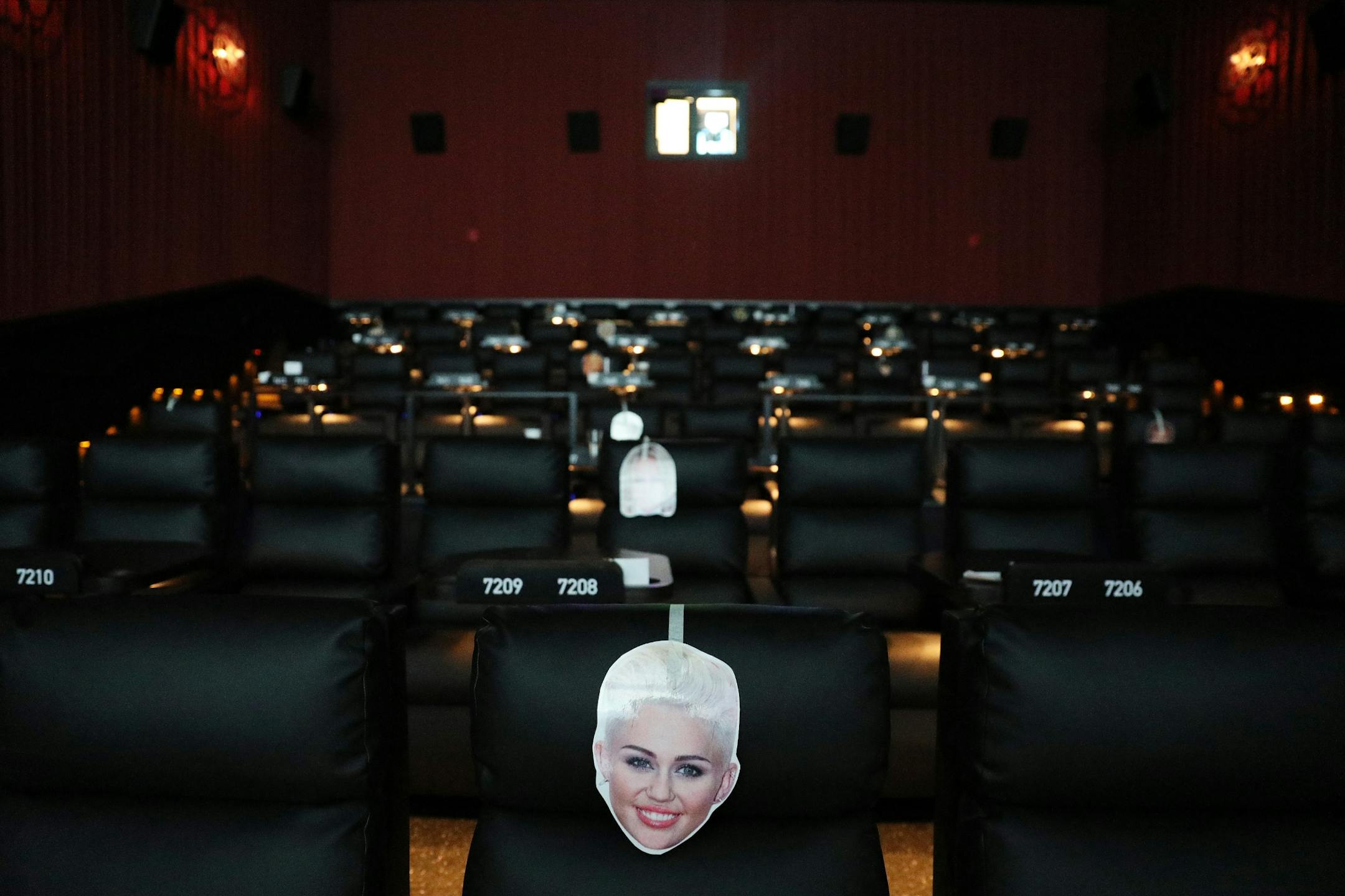 Celebrity faces including Miley Cyrus helped staff know which seats were occupied during a training session at Alamo Drafthouse Cinema.