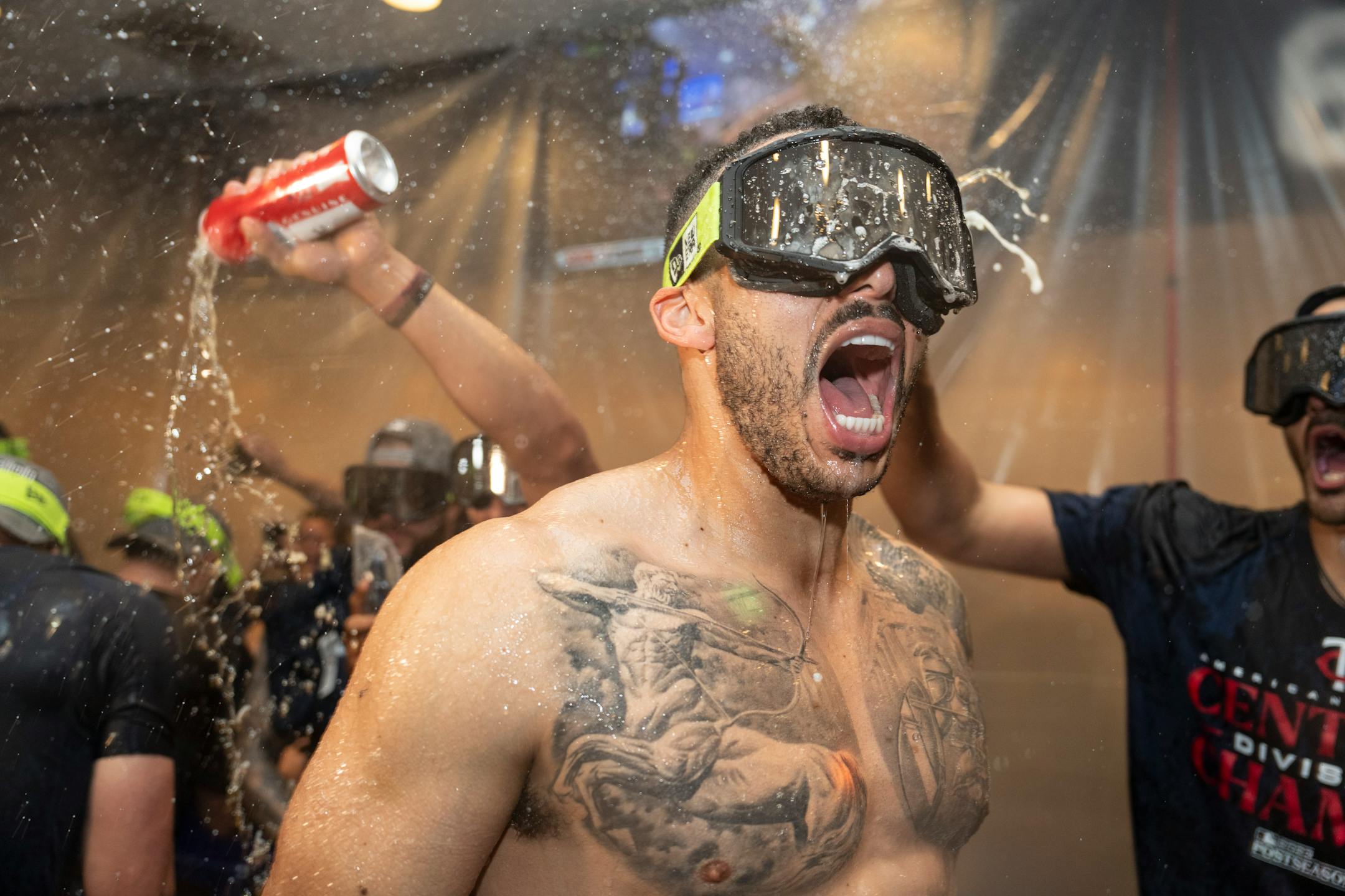 Minnesota Twins Carlos Correa and other Twins players celebrate with champagne in the locker room after clentched the American League Central title. The Minnesota Twins hosted the Los Angeles Angels at Target Field on Friday, Sept. 22, 2023 in Minneapolis, Minn. ] RENEE JONES SCHNEIDER • renee.jones@startribune.com