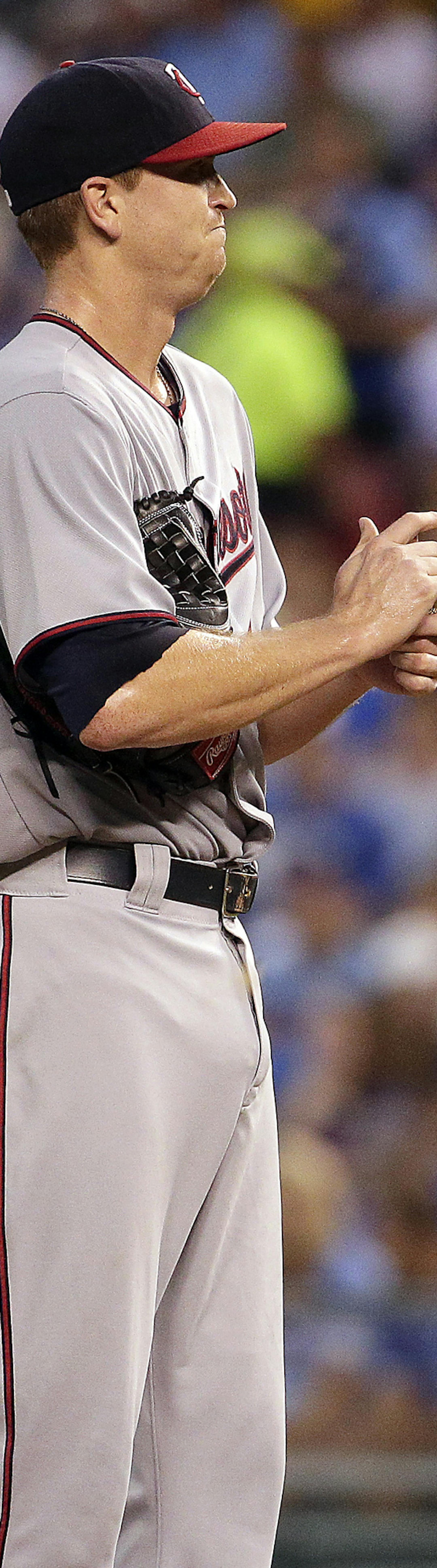 Minnesota Twins starting pitcher Kyle Gibson stands on the mound after giving up four runs during the first inning of a baseball game against the Kansas City Royals Tuesday, Sept. 8, 2015, in Kansas City, Mo. (AP Photo/Charlie Riedel) ORG XMIT: MIN2015092818173869