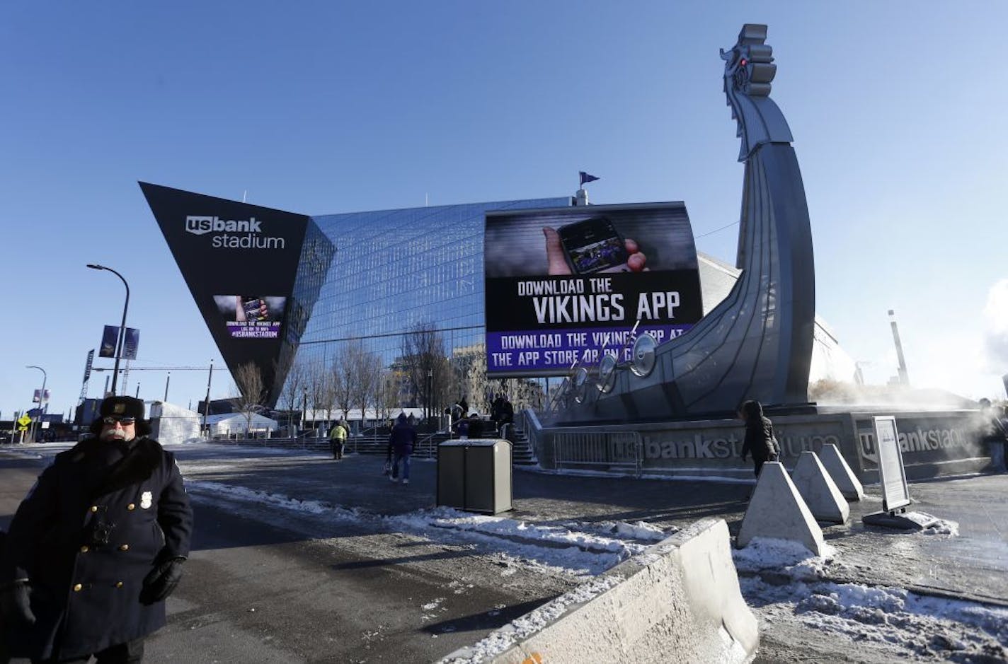 A police officer stands outside U.S. Bank Stadium before an NFL football game between the Minnesota Vikings and the Chicago Bears, Sunday, Dec. 31, 2017, in Minneapolis.