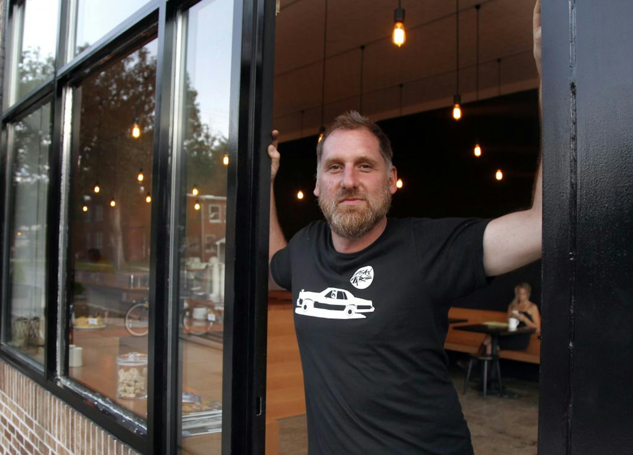 Greg Martin in the doorway of his new Urban Bean location, 2401 Lyndale Ave S.