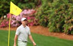 Rory McIlroy walks off the 13th hole during a practice round prior to the 2024 Masters Tournament. (Tribune News Service)