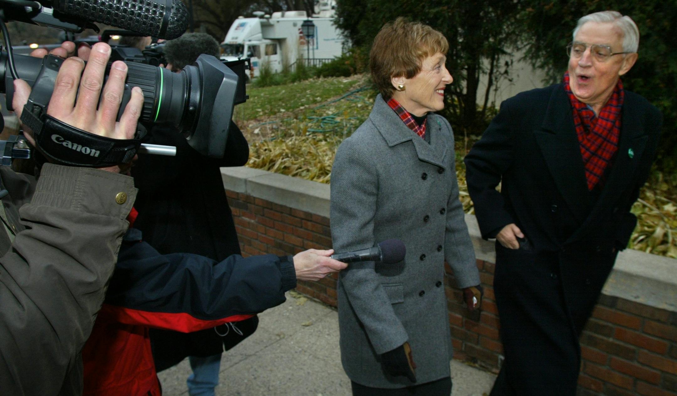 Minneapolis, MN., Tuesday, 11/5/2002. (left to right) Joan and Walter Mondale walked past lines of local and national media as they walked into St. Paul's Episcopal Church near Lake of the Isles, to cast their vote.