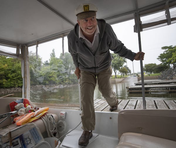 Cory Parkos co-owner of the Minneapolis WaterTaxi prepared his boat at Boom Island Marina for river ride Sunday September 1,2019 in Minneapolis, MN.] 