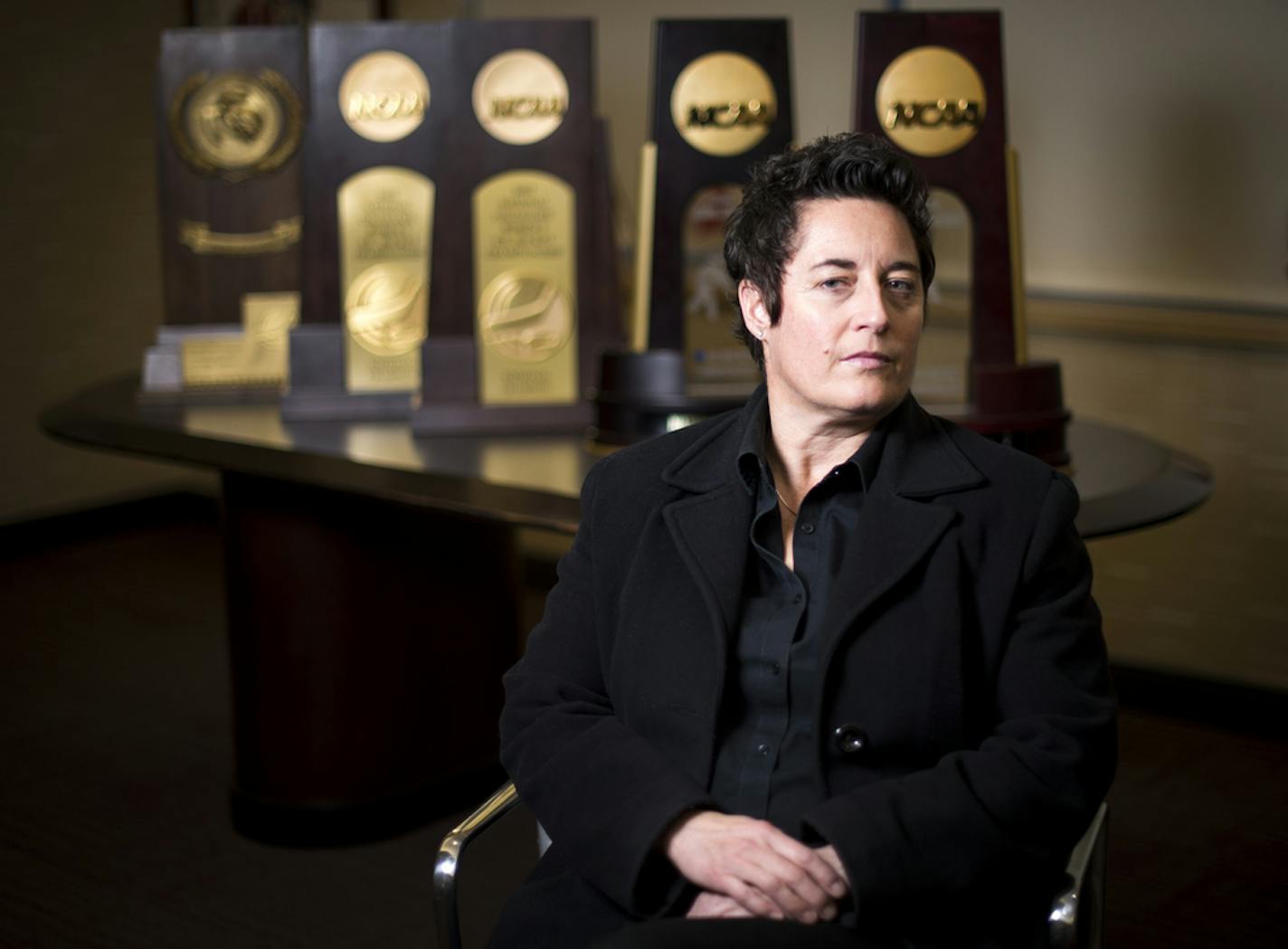 University of Minnesota Duluth womens' hockey head coach Shannon Miller is pictured in front of her five NCAA National Championship trophies in her office on Saturday night. ] (Aaron Lavinsky | StarTribune) University of Minnesota Duluth told women's hockey head coach Shannon Miller that this season would be the las of her successful run as the Bulldog's coach. After five national championships, an NCAA record, and 11 Frozen Four Victories, Miller, the highest-paid coach in women's hockey, was t