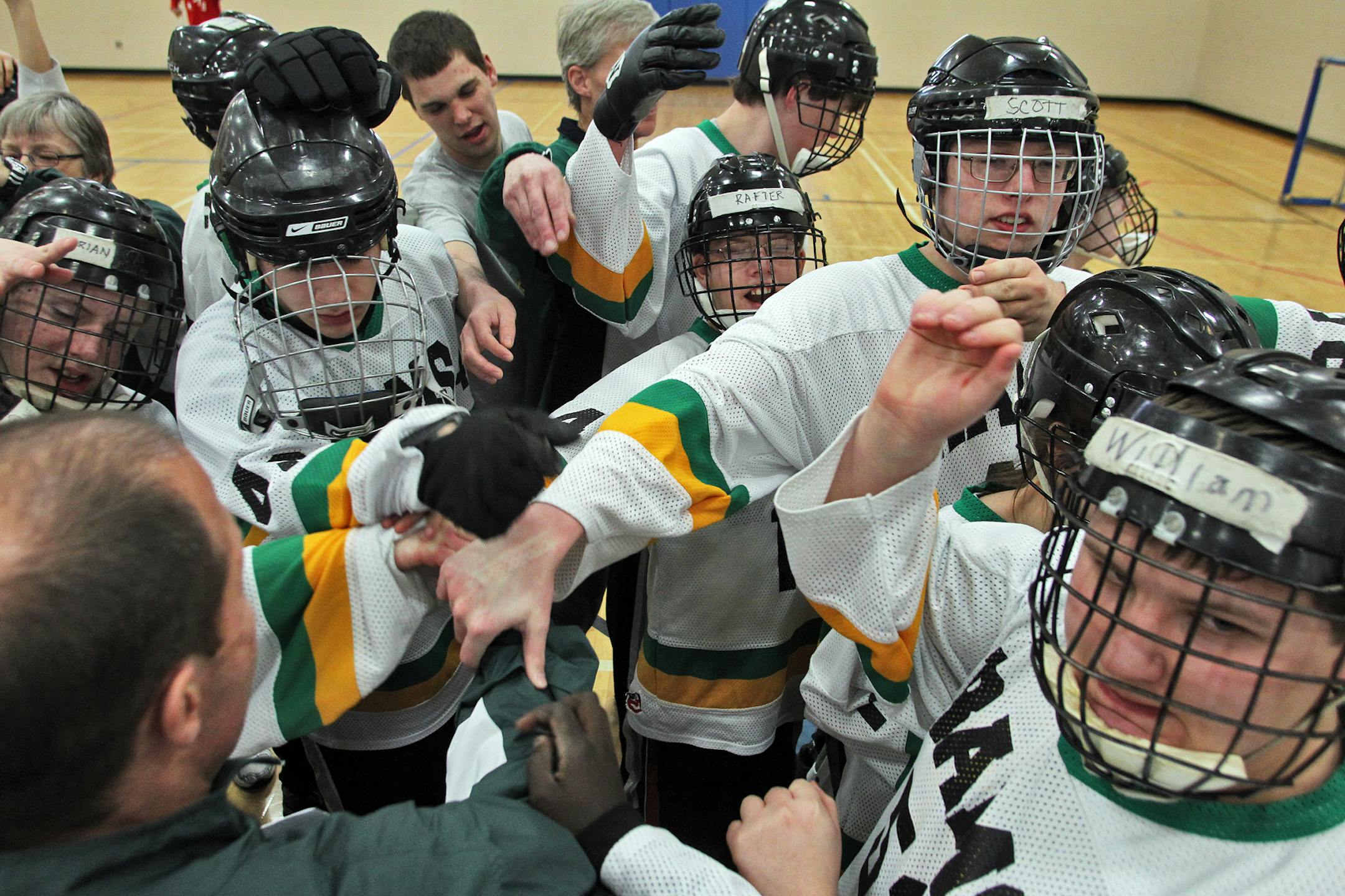 Adapted Floor Hockey game - Cognitively Impaired Division North, Varsity Playoffs - Mounds View/Irondale/Rosedale (MVIR) vs. St. Paul Highland Park. MVIR players broke from a huddle after a timeout in the game. (MARLIN LEVISON/STARTRIBUNE(mlevison@startribune.com (cq -)