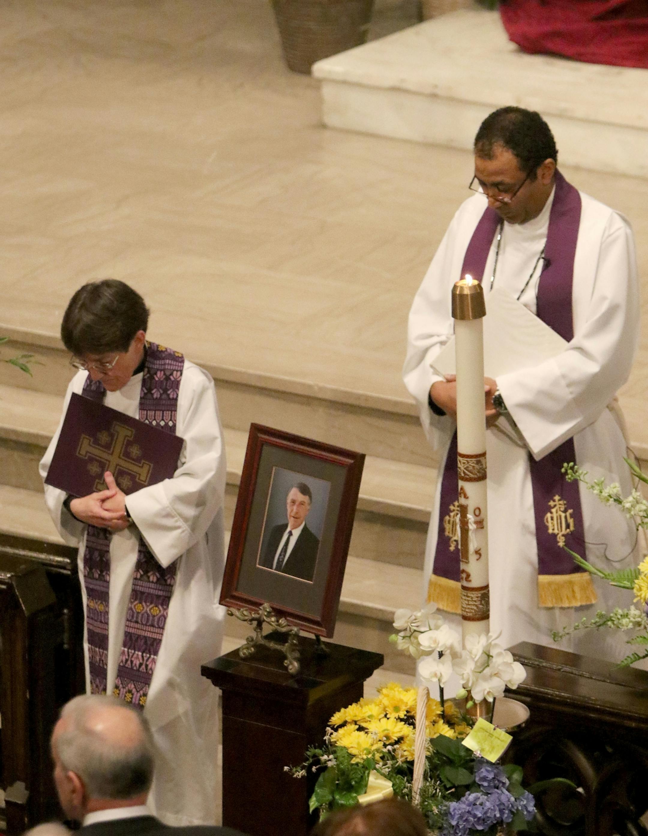 Clergy members Rev. Jane Buckley-Farlee and Rev. Alemseged Asmelash, both of Trinity Lutheran Church, process from the sanctuary at the close of funeral services for former Minnesota Congressman Martin Olav Sabo Saturday, March 19, 2016, at Central Lutheran Church in downtown Minneapolis.