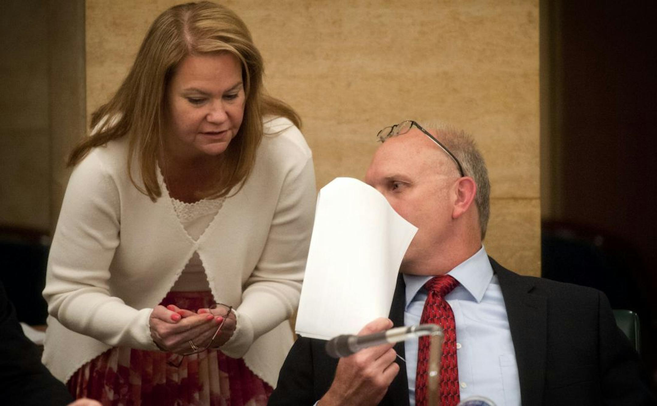 Senate Tax Committee Chair and Deputy Majority Leader Julianne Ortman, R, talked with Sen. Roger Chamberlain, R, during a break to figure out how to deal with the Racino amendment to the bill proposed by Chamberlain who covered his face with this paper. Friday, April 27, 2012