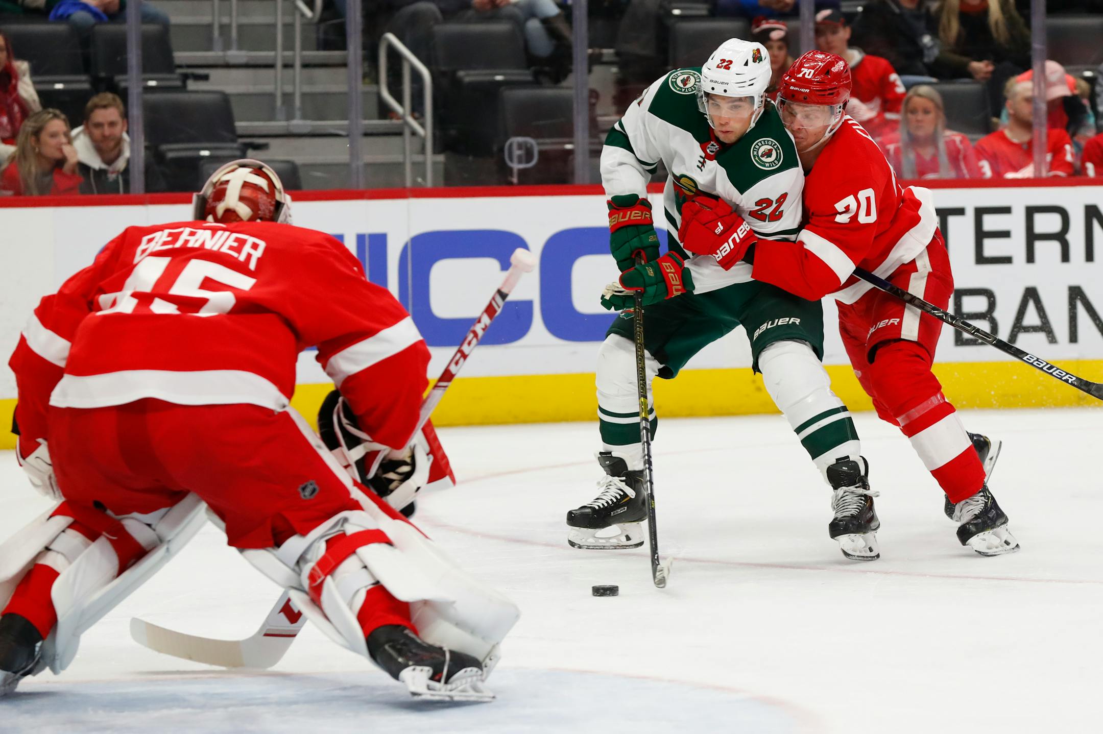 Wild left wing Kevin Fiala tries to shoot on Red Wings goaltender Jonathan Bernier as Christoffer Ehn defends in the third period