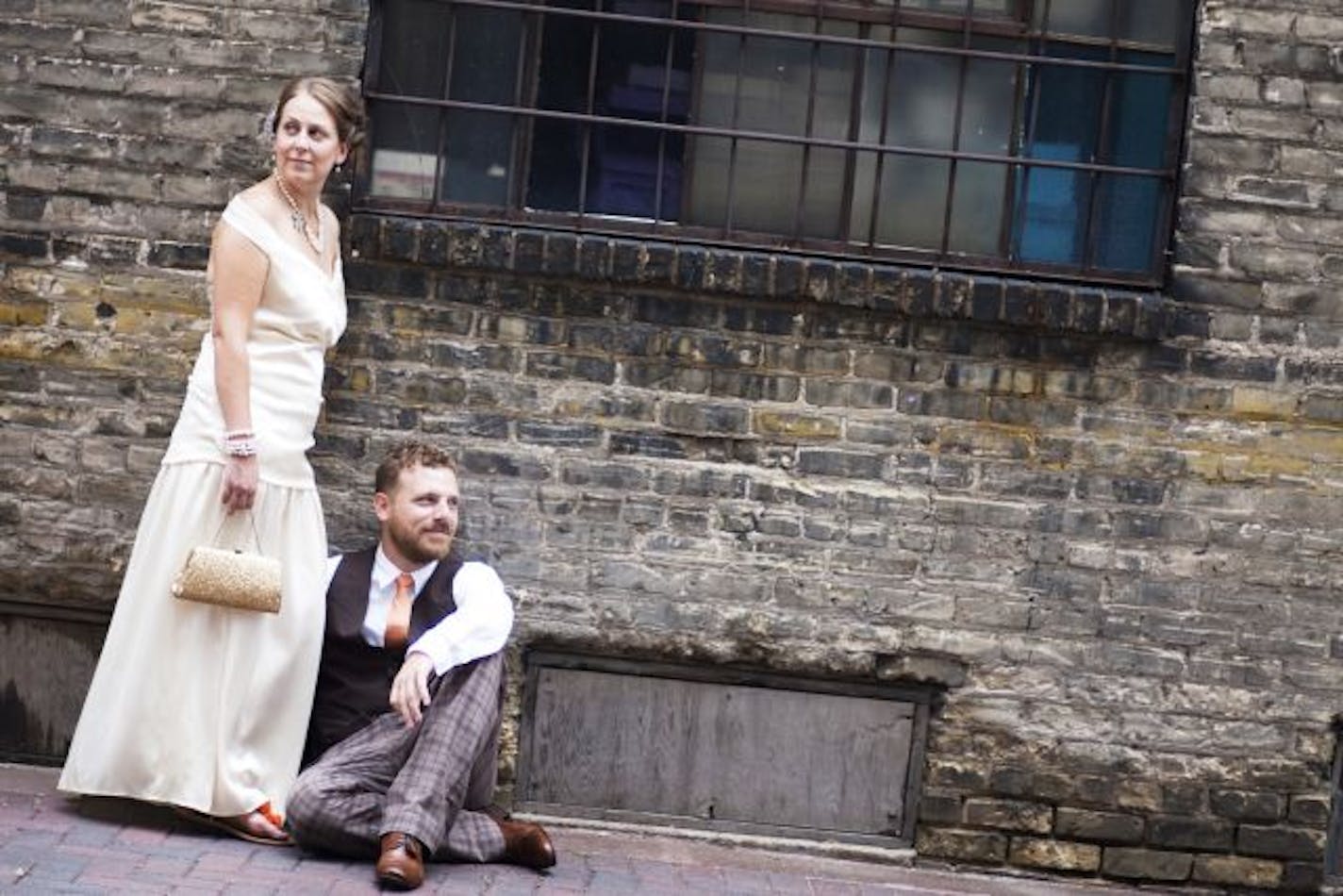 In August, Kirsten Mortensen walked down the aisle in a new and modern dress, made from the material of her grandmother's dress. She and her groom Nate Johannes posed in Loring Alley.