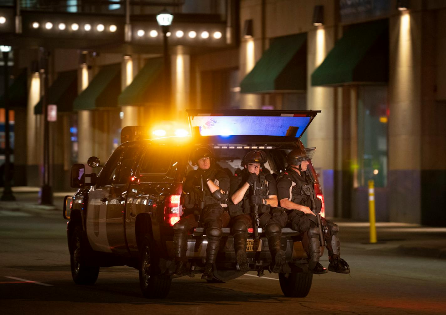 State Patrol officers enforcing curfew rode in the back of a State Patrol truck in downtown MInneapolis almost two hours after curfew began Thursday.