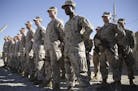 FILE - In this Jan. 15, 2018 file photo, U.S. Marines stand guard during the change of command ceremony at Task Force Southwest military field in Shor