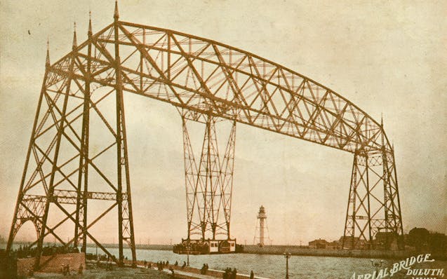 The first version of the Aerial Lift Bridge featured a gondola that transported passengers and vehicles.