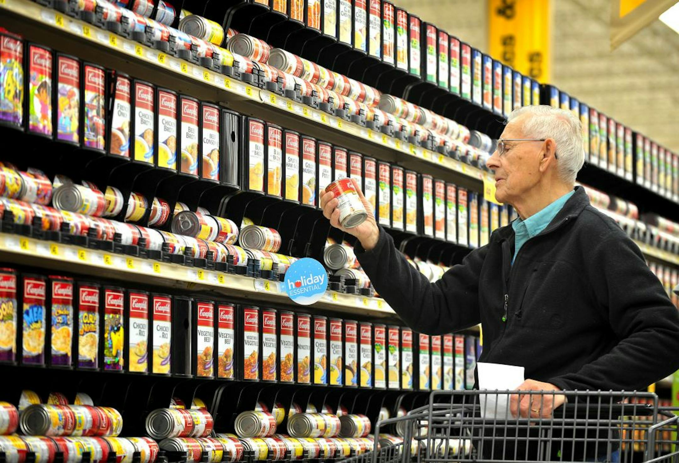 Walter Sukut of St Anthony Village looked over the soup selections at Cub Foods. New Supervalu CEO Craig Herkert said his company has been too complicated for consumers and its vendor partners, targeting types of food in which he thinks too many varieties are offered.