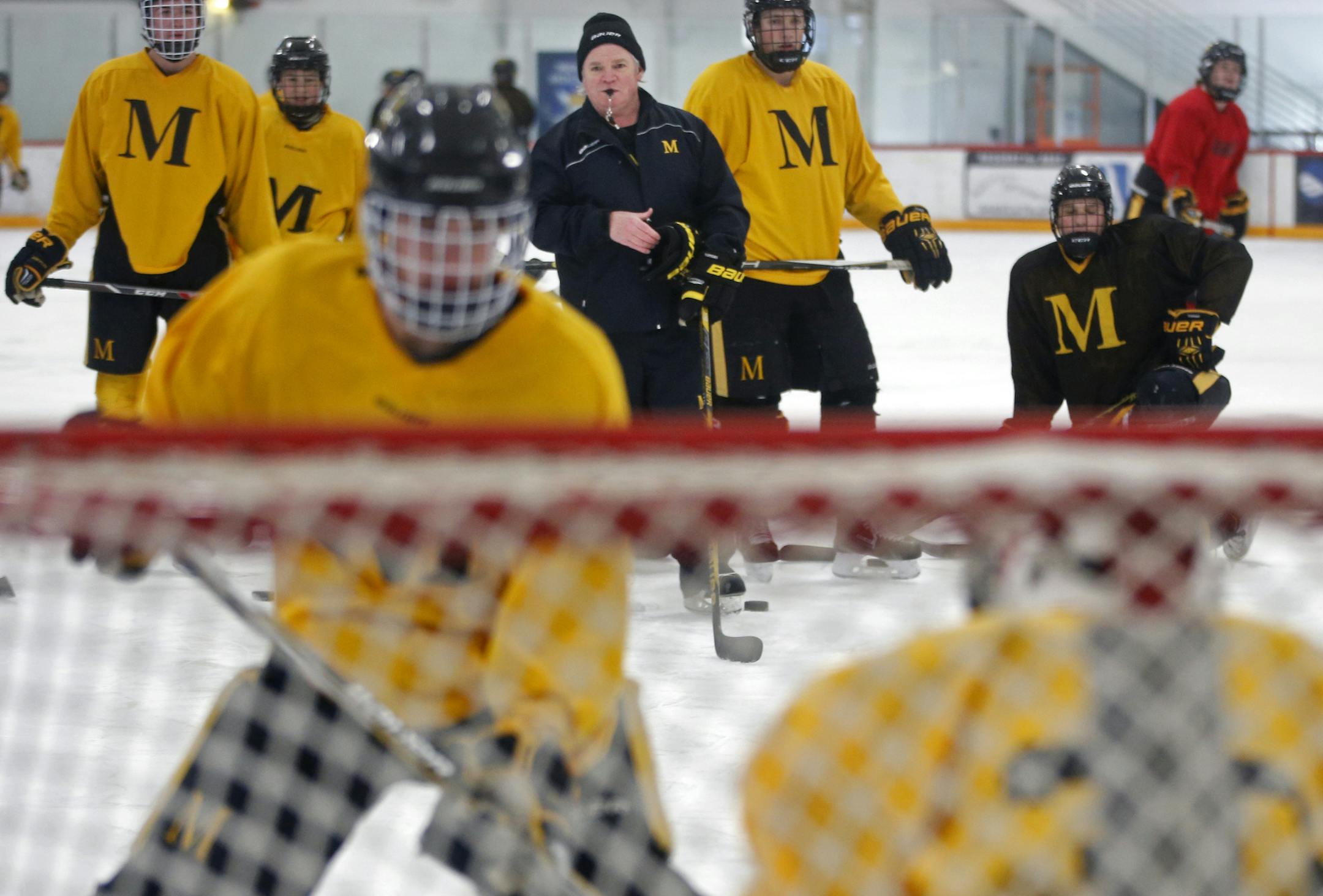 At the Mars Lakeview Arena, head coach Brendan Flaherty of Duluth Marshall oversaw practice. The school moved up to a AA schedule in spite of being small in size.] rtsong-taatarii@startribune.com/ Richard Tsong-Taatarii