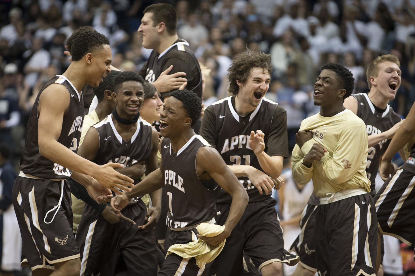 The Apple Valley Eagles rush the court in celebration after defeating Champlin Park 64-61 in the Class 4A Championship game on Saturday night. ] (Aaron Lavinsky | StarTribune) Champlin Park takes on Apple Valley in the Class 4A boys' basketball championship game on Saturday, March 14, 2014 at Target Center.